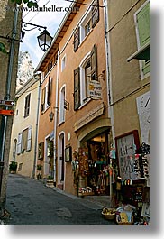 buildings, europe, france, gifts, moustiers, narrow, narrow streets, provence, st marie, stores, streets, structures, vertical, photograph