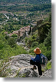 backpack, clothes, colors, europe, france, hats, landscapes, moustiers, oranges, provence, scenics, st marie, vertical, viewing, womens, photograph