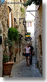 couiple, couples, europe, france, men, narrow, people, provence, st paul, streets, vertical, walking, womens, photograph