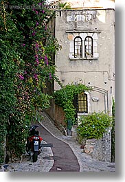 bougainvilleas, cobblestones, europe, flowers, france, houses, ivy, materials, motorcycles, nature, paths, plants, provence, st paul, stones, vertical, photograph