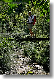 activities, backpack, bridge, clothes, colors, europe, forests, france, green, groups, hiking, men, nature, nicos, people, plants, provence, red, structures, swing bridge, swings, trees, vertical, photograph
