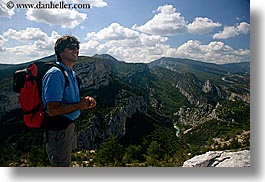 activities, backpack, clothes, clouds, colors, europe, france, groups, hiking, horizontal, men, mountains, nature, nicos, people, provence, red, scenics, sky, sunglasses, viewing, photograph