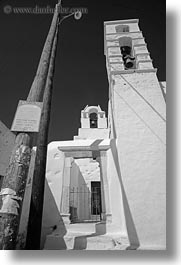 amorgos, bell towers, black and white, buildings, churches, europe, greece, lamp posts, structures, vertical, white wash, photograph