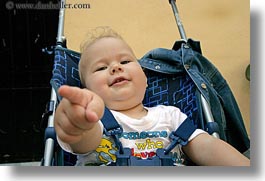 athens, babies, emotions, europe, fingers, greece, horizontal, people, pointing, smiles, stroller, photograph