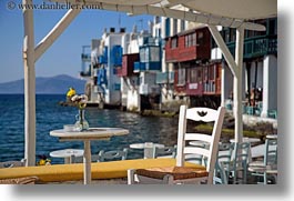 buildings, chairs, europe, flowers, greece, horizontal, mykonos, tables, waterfront, photograph