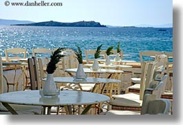 chairs, europe, greece, horizontal, mykonos, ocean, plants, tables, views, photograph