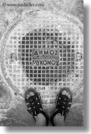 black and white, covers, europe, feet, greece, manholes, mykonos, vertical, white wash, photograph