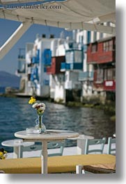 europe, flowers, greece, mykonos, tables, vertical, yellow, photograph