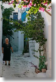 alleys, europe, greece, mykonos, old, people, vertical, walking, white wash, womens, photograph