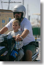 boys, clothes, europe, fathers, glasses, greece, motorcycles, naxos, people, vertical, photograph
