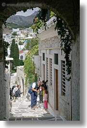 cameras, childrens, digital, europe, greece, men, naxos, people, showing, vertical, photograph