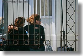 bars, behind, couples, europe, greece, hair, horizontal, irons, naxos, people, red, photograph
