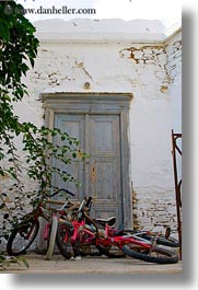bicycles, colors, doors, europe, greece, naxos, red, vehicles, vertical, photograph