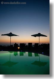 dusk, europe, greece, hotels, pools, santorini, sunsets, swimming pool, umbrellas, vertical, photograph