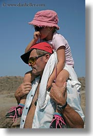 colors, emotions, europe, fathers, girls, greece, humor, pink, santorini, shoulders, vertical, photograph