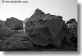 black and white, europe, greece, holes, horizontal, rocks, tinos, photograph