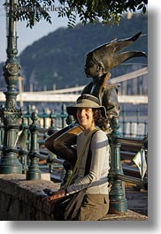 brunette, clothes, emotions, europe, groups, hair, hats, hungary, lori, people, princess, smiles, statues, vertical, womens, photograph