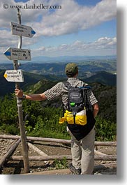 backpack, baseball cap, clothes, clouds, directional, europe, groups, hats, hikers, hungary, landscapes, looking, men, nature, over, people, ron seely, signs, sky, tour guides, vertical, photograph