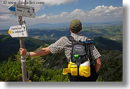 backpack, baseball cap, clothes, clouds, directional, europe, groups, hats, hikers, horizontal, hungary, landscapes, looking, men, nature, over, people, ron seely, signs, sky, tour guides, photograph