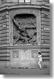 arts, black and white, budapest, cell phone, communist, europe, hungary, relief, vertical, walking, womens, photograph