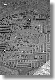 black and white, budapest, covers, europe, hungary, irons, manhole covers, manholes, materials, vertical, photograph
