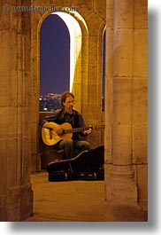 archways, artists, budapest, europe, guitars, hungary, instruments, men, music, musicians, nite, people, players, slow exposure, vertical, windows, photograph