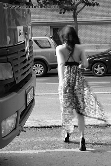 woman-walking-by-bus-bw-1.jpg