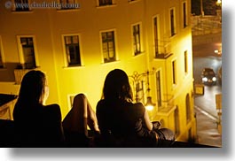 budapest, cars, colors, europe, horizontal, hungary, nite, people, silhouettes, watching, womens, yellow, photograph