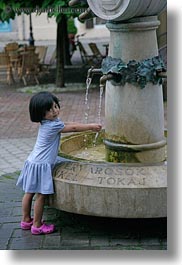 asian, childrens, emotions, europe, fountains, girls, hands, hungary, little, people, smiles, tarcal, vertical, washing, water, photograph