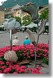 bolzano, dolomites, europe, flowers, italy, people, sculptures, vertical, photograph