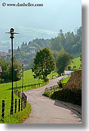 alto adige, dolomites, europe, fences, italy, lamp posts, roads, rosengarten, valley, vertical, photograph