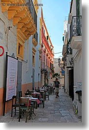 alleys, europe, gallipoli, italy, narrow, puglia, restaurants, tables, vertical, photograph