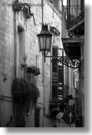 balconies, black and white, europe, italy, lamp posts, lecce, lights, puglia, street lamps, vertical, photograph