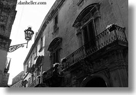 balconies, black and white, europe, horizontal, italy, lamp posts, lecce, lights, perspective, puglia, street lamps, upview, photograph