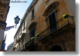 balconies, europe, horizontal, italy, lamp posts, lecce, lights, perspective, puglia, street lamps, upview, photograph