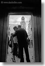 black and white, churches, doors, europe, italy, noci, people, puglia, vertical, photograph