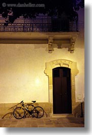 bicycles, bikes, doors, europe, italy, nite, otranto, puglia, vertical, photograph