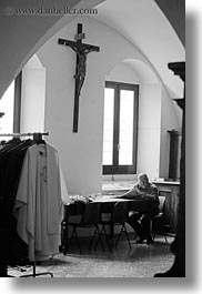 black and white, churches, europe, italy, otranto, paper, priests, puglia, reading, vertical, photograph