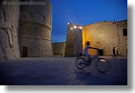 bicycles, castles, childrens, europe, evening, horizontal, italy, otranto, people, puglia, photograph