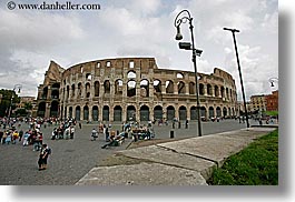 architectural ruins, archways, buildings, colosseum, crowds, europe, horizontal, italy, lamp posts, landmarks, people, piazza, rome, structures, photograph