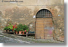 archways, doors, europe, flowers, geraniums, horizontal, italy, montalcino, towns, tuscany, photograph
