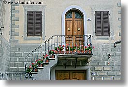 archways, balconies, doors, europe, flowers, geraniums, horizontal, italy, montalcino, towns, tuscany, photograph