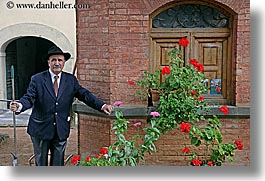bricks, europe, flowers, gardeners, gardens, geraniums, horizontal, italy, men, montalcino, shed, towns, tuscany, photograph