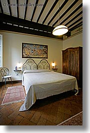 bedrooms, beds, europe, hotel albergo giglio, hotels, italy, montalcino, slow exposure, teracotta, towns, tuscany, vertical, photograph