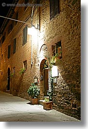 archways, bricks, doors, europe, italy, long exposure, montalcino, nite, plants, restaurants, stores, towns, tuscany, vertical, photograph