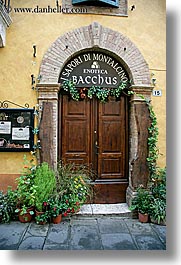 archways, bricks, doors, europe, italy, montalcino, plants, stores, towns, tuscany, vertical, wines, photograph