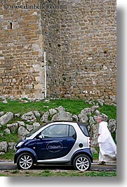 cars, europe, italy, monks, montalcino, people, streets, towns, tuscany, vertical, walking, photograph