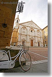 bell towers, bicycles, churches, europe, italy, pienza, religious, towns, tuscany, vertical, white, photograph
