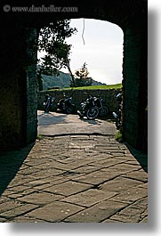 archways, europe, italy, motorcycles, populonia, towns, tuscany, vertical, photograph