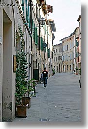 cobblestones, europe, italy, men, san quirico, towns, tuscany, vertical, walking, photograph